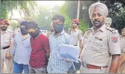  ?? HT PHOTO ?? The accused in police custody in Jalandhar on Thursday.