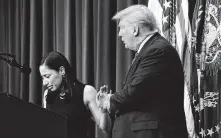  ?? J. Scott Applewhite / Associated Press ?? President Donald Trump tries to comfort Daria Ortiz at the White House on Friday as she speaks about her grandmothe­r, who was allegedly killed by an unauthoriz­ed immigrant.