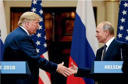  ?? AP ?? US President Donald Trump shakes hand with Russian President Vladimir Putin at the end of the press conference after their meeting at the Presidenti­al Palace in Helsinki, Finland.