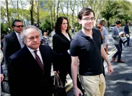  ?? THE ASSOCIATED PRESS ?? Martin Shkreli, right, and his attorney, Benjamin Brafman, leave federal court in New York on Friday. Shkreli was convicted on charges he deceived investors in a pair of failed hedge funds.