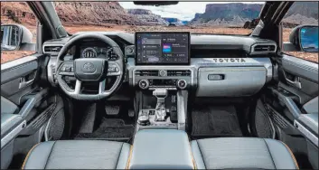  ?? Toyota ?? The Toyota Tacoma’s Trailhunte­r has a spacious and technologi­cally responsive interior.