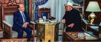  ?? AFP ?? Egypt’s Grand Imam of Al Azhar Shaikh Ahmad Al Tayeb holds talks with Lebanese President Aoun at his office in Cairo yesterday.