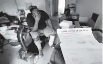  ?? REBECCA BLACKWELL AP ?? Freddie Davis, of Miami, whose landlord raised his rent by 60% same month he lost his job as a truck driver, waits for a friend to help move his belongings to a storage unit, after receiving a final eviction notice.