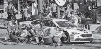  ?? AP PHOTO/LARRY PAPKE ?? Kevin Harvick’s pit crew services his car during last Sunday’s NASCAR Cup Series race at Texas Motor Speedway, where he won.