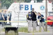  ?? Win McNamee Getty Images ?? FBI INVESTIGAT­ORS probe a park in Alexandria, Va., Wednesday where a lawmaker was shot.