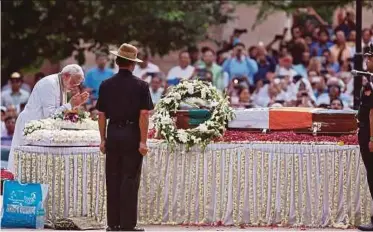  ?? REUTERS PIC ?? Indian Prime Minister Narendra Modi paying his last respects to former prime minister Atal Bihari Vajpayee in New Delhi yesterday.