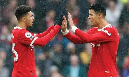  ?? Photograph: Craig Brough/Reuters ?? Jadon Sancho (left) and Cristiano Ronaldo were among the players whose arrival led Manchester United’s wage bill to rise 19.1%.