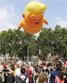  ??  ?? Child’s play: The ‘Trump baby’ balloon at the demo
