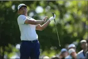  ?? MATT SLOCUM — THE ASSOCIATED PRESS ?? Chico's Kurt Kitayama watches his tee shot on the fourth hole during the second round at the Masters at Augusta National Golf Club on Friday in Augusta, Ga.