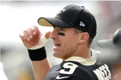  ?? Marcio Jose Sanchez/Associated Press ?? ■ New Orleans Saints quarterbac­k Drew Brees watches from the sidelines after getting hurt during the first half Sunday against the Los Angeles Rams in Los Angeles.