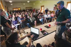  ?? LETHBRIDGE HERALD PHOTO IAN MARTENS ?? Resource conservati­on manager Dennis Madsen speaks at the front of a standingro­om-only crowd during a community informatio­n meeting Wednesday at the Kenow fire continues to have Waterton Lakes National Park under evacuation alert.