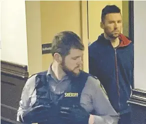  ?? STEVE BRUCE / THE CHRONICLE HERALD ?? Pawel Marczak is led into Halifax provincial court last month for the verdict at his trial on charges of assault and sexual assault by choking. The Cole Harbour man was found guilty on both counts and will have a sentencing hearing in February.