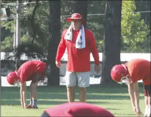  ?? The Sentinel-Record/Richard Rasmussen ?? PRACTICE OVER: Mountain Pine head football coach Sam Counce runs a practice on Aug. 3. The Red Devils football team is quarantine­d for the next two weeks after an athlete tested positive for COVID-19.