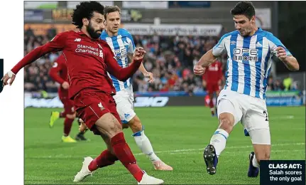  ??  ?? CLASS ACT: Salah scores the only goal