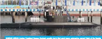  ?? — AFP ?? BANDAR ABBAS: Iranian President Hassan Rouhani unveils Iran’s first semi-heavy submarine named Fateh at the Bandar Abbas naval base yesterday.