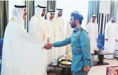  ??  ?? Left: Shaikh Saud Bin Rashid and Shaikh Rashid Bin Saud Bin Rashid Al Mualla of Umm Al Quwain receive Eid greetings.