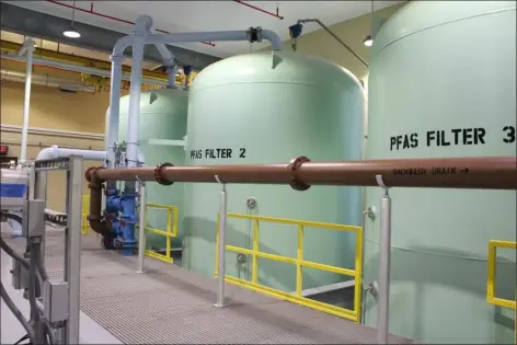  ?? CAMERON MORSBERGER — LOWELL SUN ?? Four PFAS filtration tanks — which contain granular activated carbon — line the back of the Littleton Electric Light and Water Department­s’ Whitcomb Avenue Water Treatment Plant. The town celebrated the constructi­on of the plant Sept. 13, 2023, after the project broke ground June 2021.