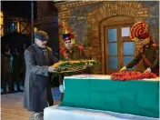 ?? — PTI ?? Adviser to governor Vijay Kumar pays floral tributes to police head constable Abdur Rashid who was killed in an encounter with militants at Pinglan in Pulwama district on Monday.