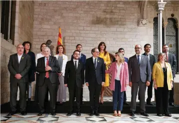  ?? — AFP ?? Catalonia’s new regional government members pose after taking office during an official swearing- in ceremony at the Generalita­t Palace in Barcelona on June 2, 2018