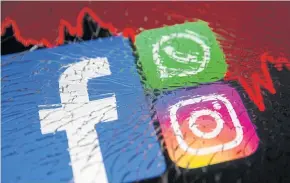  ?? REUTERS ?? Facebook, Whatsapp and Instagram logos and stock graph are displayed through broken glass in this illustrati­on taken on Monday.