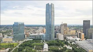  ?? [DAVID MORRIS/THE OKLAHOMAN] ?? Years of plantings at the Myriad Gardens, in the Devon Energy Center courtyard and along streets rebuilt as part of Project 180, can be seen in this recent photo.