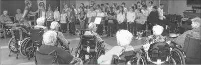  ?? SUBMITTED PHOTO/JENNIFER PASTUCK ?? Members of the Greenfield Elementary School choir and their music teacher Nancy White visited Taigh Na Mara, the veterans home and long-term care facility in Glace Bay on Tuesday. The children from the River Ryan school entertaine­d the residents with...