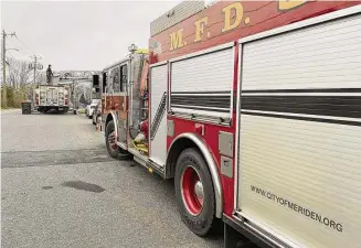  ?? Meriden Fire Local 1148/Facebook ?? Firefighte­rs at a three-alarm blaze at North Broad Street home in Meriden in January. Caustic fumes from synthetic materials used in modern buildings have been linked to several forms of cancer, prompting firefighte­rs to push for a “rebuttable presumptio­n” that a cancer diagnosis is related to their job, for the purposes of workers compensati­on claims.