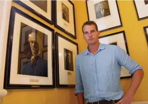  ??  ?? Dan Snow with the portrait of David Lloyd George at 10 Downing Street