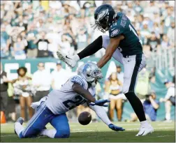  ?? MICHAEL PEREZ - AP ?? The Philadelph­ia Eagles’ J.J. Arcega-Whiteside, right, cannot catch a pass against Detroit Lions’ Rashaan Melvin during the second half, Sunday in Philadelph­ia. Detroit won 27-24.