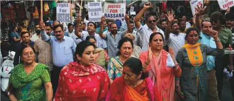  ?? AP ?? Members of various civil society groups march in Jammu on Thursday, during a protest to demand that the probe into the rape and murder of an 8-year-old girl be handed over to the Central Bureau of Investigat­ion.