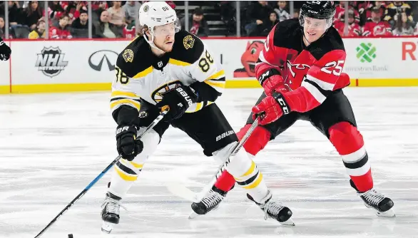  ?? STEVEN RYAN/GETTY IMAGES ?? Since 2014, the Boston Bruins have used the draft to acquire several excellent young players, including talented goal scorer David Pastrnak, left, who is just 21.