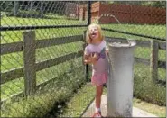  ??  ?? The wild water fountain was one of the highlights for Anna, 6, while visiting Lehigh Valley Zoo in Schnecksvi­lle on July 15.