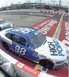  ?? GETTY IMAGES ?? Chase Briscoe crosses the finish line in front of Kyle Busch in the Xfinity Series race at Darlington Raceway on Thursday.