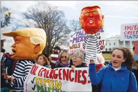 ?? Associated Press photo ?? People gather on Presidents Day, Monday in front of the White House in Washington, to protest that President Donald Trump declared a national emergence along the southern border.