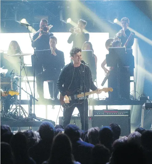  ?? NATHAN DENETTE / THE CANADIAN PRESS ?? The Arkells perform in their hometown of Hamilton at the 2015 Juno Awards. Music critic Andrew Baulcomb examines the rise of the city’s music scene in Evenings and Weekends: Five Years in Hamilton Music, 2006–2011