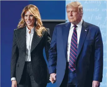 ??  ?? Melania et Donald Trump, après le débat des candidats à la présidence des États-Unis, mardi. - Associated Press