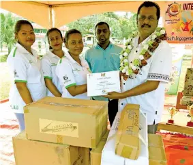  ?? Photo: Shratika Naidu ?? Minister for Youth and Sports Parveen Bala (right) hand over a grant to the Shilo Youth Club during the Internatio­nal Youth Day at Katonivere Ground in Labasa on August 13, 2020.