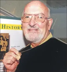  ??  ?? Bill McLaughlin with the medal his grandfathe­r, James McLaughlin, won in Celtic’s first ever cup win in season 1888-89.