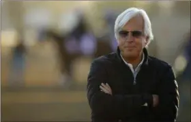  ?? CHARLIE RIEDEL —ASSOCIATED PRESS ?? Trainer Bob Baffert watches a morning workout at Churchill Downs on May 1.