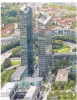  ?? FOTO: DPA ?? Die Münchener Highlight Towers, das neue Tengelmann-Domizil.