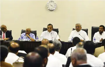  ??  ?? Jayasuriya (centre) looks on at a meeting of MPs at the Parliament Building in Colombo. — AFP photo