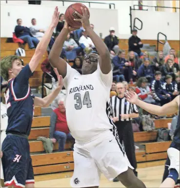  ?? / Scott Herpst, file photo ?? Ridgeland’s Fred Norman, Jr. crashes the boards during a game against Heritage last season. Norman was an All-region selection after averaging over 16 points and 10 rebounds a contest.