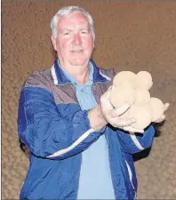 ?? +*. %": 5)& (6"3%*"/ ?? Terry Curley of Murnaghan Farms holds up some chipping potatoes in one of his warehouses in Norboro, P.E.I. The family-run operation is contracted to supply 50 million pounds of spuds to Frito Lay each year.