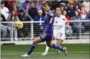  ?? MARK ZALESKI — THE ASSOCIATED PRESS ?? U.S. forward Mallory Swanson, right, kicks the ball past Japan defender Moeka Minami during the first half of a Shebelieve­s Cup match Sunday.