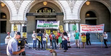  ?? Wikicommon­s/TED EYTAN ?? Protesters march in September outside the then newly opened Trump Internatio­nal Hotel.