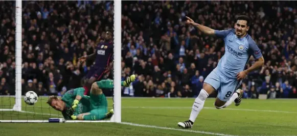  ?? PHIL NOBLE/REUTERS ?? Manchester City’s Ilkay Gundogan celebrates his first-half goal, which started a rally that led to a 3-1 win over Spanish power Barcelona, the old team of City coach Pep Guardiola.