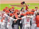  ?? DANNY KARNIK/ASSOCIATED PRESS ?? St. Louis players celebrate around the mound after beating Atlanta in Game 5 of the NLDS on Wednesday.