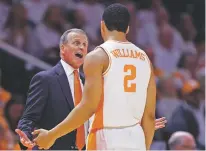  ?? WADE PAYNE/ASSOCIATED PRESS ?? Tennessee coach Rick Barnes talks with forward Grant Williams during Saturday’s game against Florida. Tennessee won 73-61. Tennessee remains the No. 1 team in the latest Associated Press Top 25 poll.