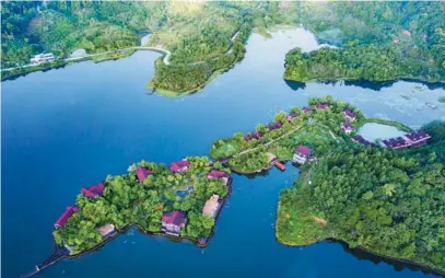  ?? PU XIAOXU / XINHUA ?? A view of Jiangfengl­ing Tianchi Lake in the Hainan Tropical Rainforest National Park, Hainan province.