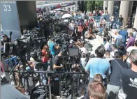  ?? SERGIO PEREZ / REUTERS ?? Throngs of media gather outside the courthouse where Real Madrid star Cristiano Ronaldo was testifying on tax-fraud charges in Pozuelo de Alarcon, Madrid last week.